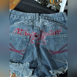Romwe blue denim shorts with frayed hem and pockets. Size XS